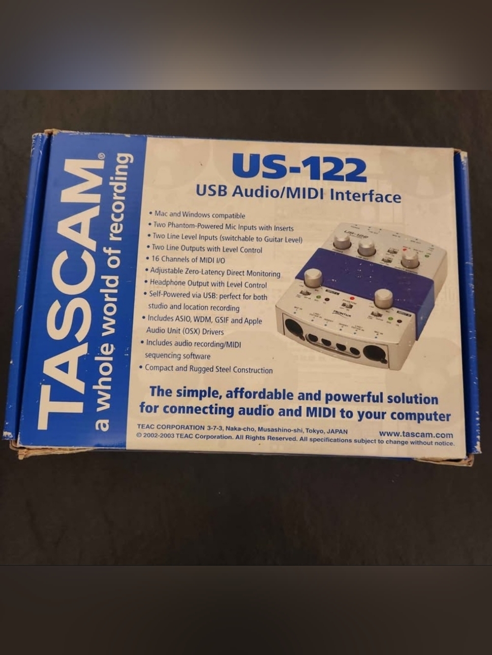 TASCAM USB-122 Audio/MIDI Interface in blue and White.